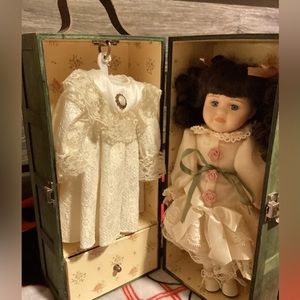 Vintage porcelain doll with dress and wardrobe box